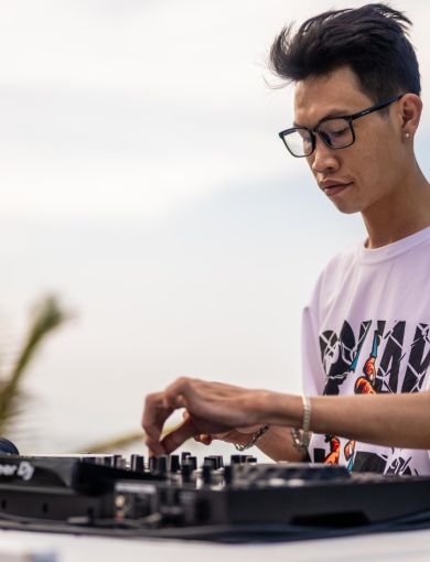 DJ spinning tunes on An Bang Beach at Shore Club, Hoi An Vietnam
