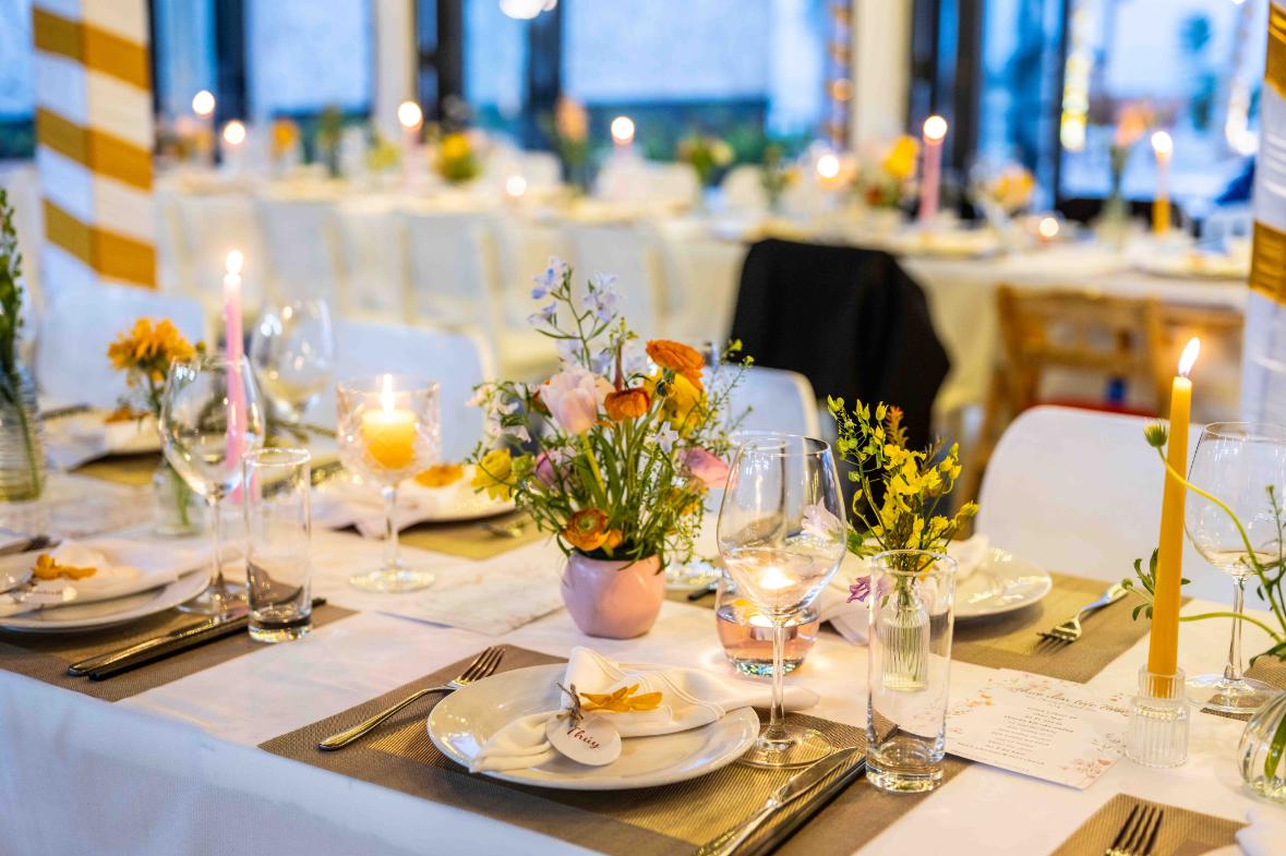 Romantic table settings and flower arrangements at Shore Club, An Bang Beach, perfect for Valentine’s Day celebrations by the sea in Hoi An, Vietnam.