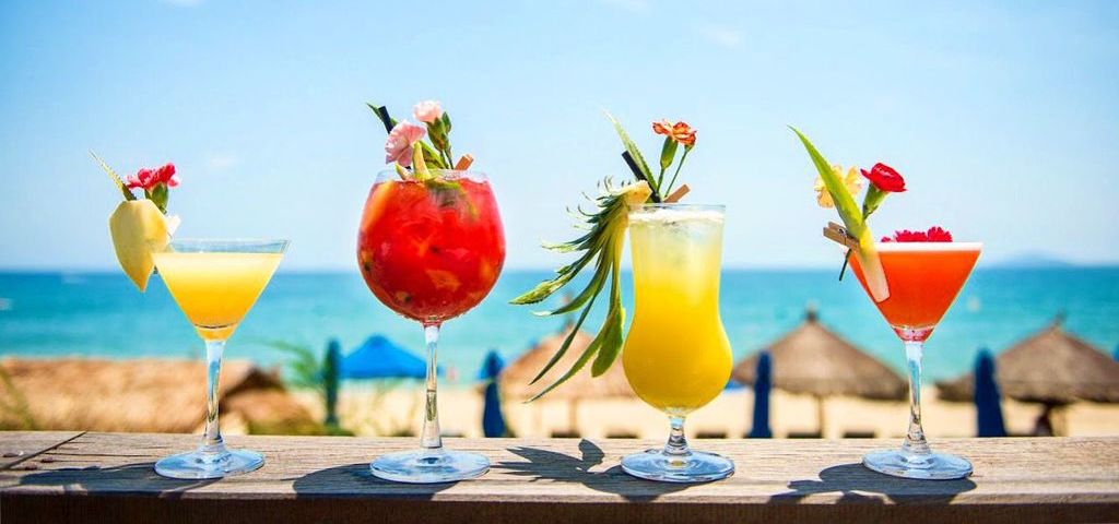 4 of our signature cocktails by the beach