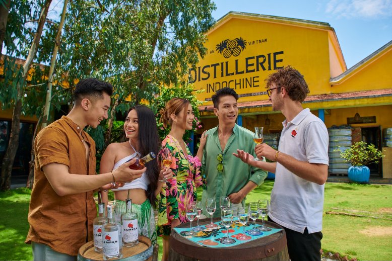 Guests learn about the making of award-winning, locally made Sampan Rhum in their private garden at the Distillerie d'Indochine outside of Hoi An, Vietnam