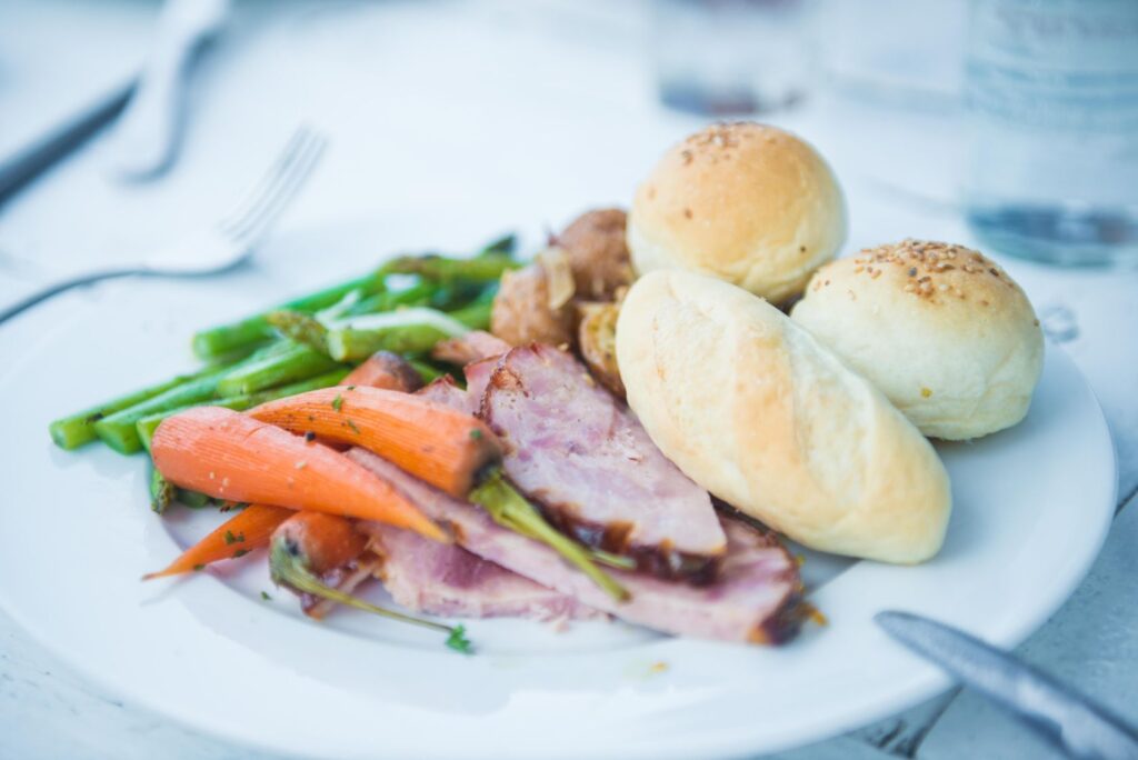 honey roasted ham, fresh cut, sauteed carrots and green beans served with freshly baked bread at Shore Club, An Bang Beach, Hoi An, Vietnam for Easter Sunday Brunch