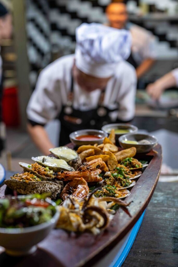 Our signature fresh seafood boat at Shore Club on An Bang Beach, Hoi An, featuring a variety of delicious ocean catches.