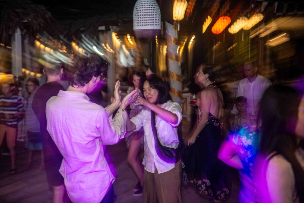 guests dancing at Shore Club Hoi An on An Bang Beach