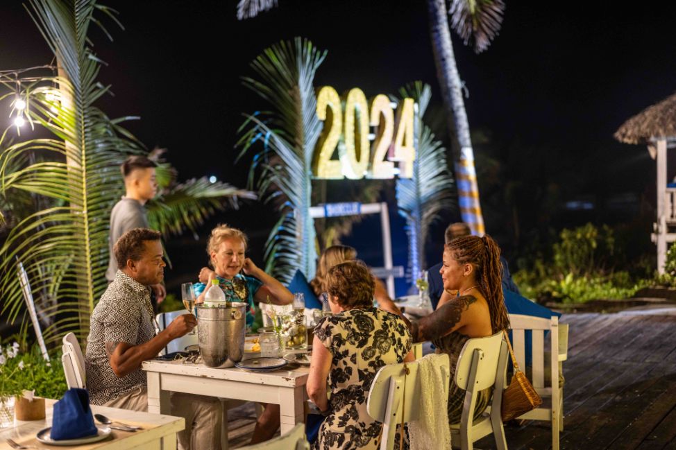 guests enjoying New Year's Eve dinner under the stars at Shore Club Hoi An on An Bang Beach