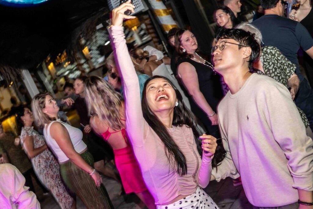 Guests take a selfie while dancing at Shore Club An Bang Beach Hoi An - New Years Eve