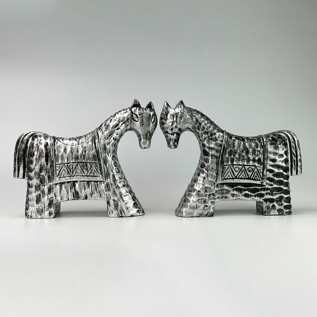 Two silver horse sculptures made from upcycled driftwood from the Cui Lu Collection, Hoi An, Vietnam